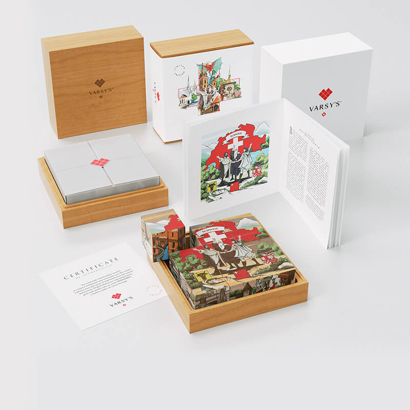 [:en]A booklet with 6 legends of Switzerland, like the story of the Oath on the Rütli, 9 beechwood cubes in a massive wooden box - VARSY’S Legendbox Set 1 is the perfect souvenir from Switzerland.[:de]Ein Büchlein mit 6 Legenden aus der Schweiz, wie der Geschichte vom Rütlischwur, 9 Holzwürfel in einer massiven Holzbox - VARSY’S Legendenbox Set 1 ist das perfekte Geschenk Schweiz.[:]